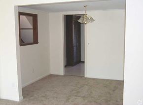 Henrietta apartment for rent - an empty living room with a window and a door