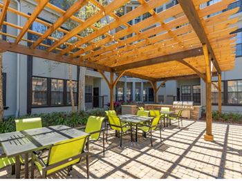 Outdoor bbq grill area with seating
