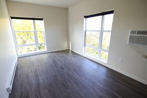 Grand Forks apartment for rent - an empty living room with wood floors and a window