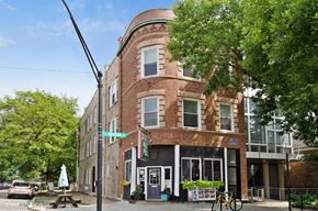 Chicago apartment for rent - a brick building on the corner of a street
