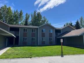 Anchorage apartment for rent - Apartment complex with a no parking sign in front.