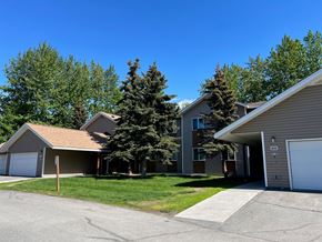 Anchorage apartment for rent - A residential area with houses and trees.