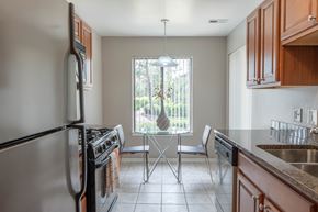 Arlington Heights townhouse for rent - A kitchen with a stove top oven and a dishwasher.