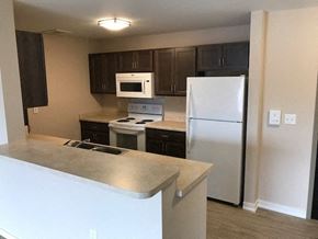 Pittsburgh apartment for rent - a kitchen with a stove and a refrigerator