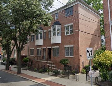 Jersey City apartment for rent - A brick building with a sign that says 1 way.