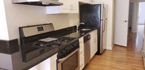 Jersey City apartment for rent - A black stove top oven with a digital display in the middle.