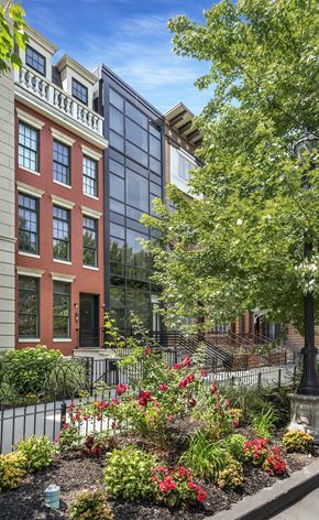 Jersey City apartment for rent - a city with a garden in front of a building