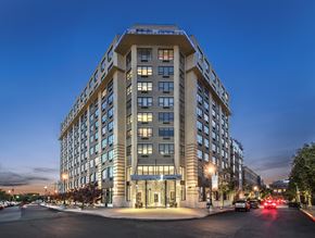 Jersey City apartment for rent - a large building on a city street at night