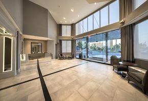 Jersey City apartment for rent - a large living room with large windows and a large tiled floor