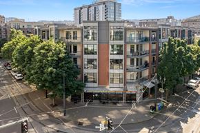 Portland apartment for rent - an aerial view of a building with trees in front of it