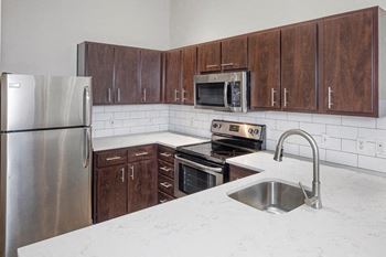 Kitchen with microwave at kearney plaza apartments in portland, oregon