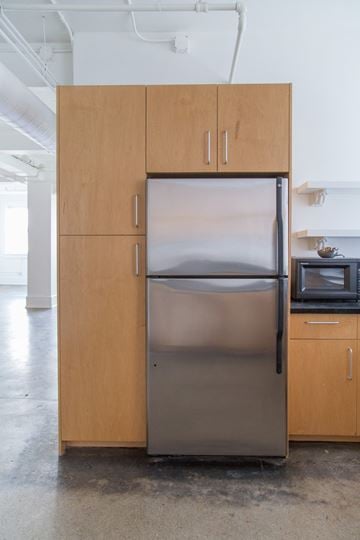 Detroit apartment for rent - a stainless steel refrigerator and cabinets in a kitchen