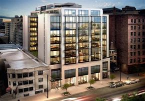 Chicago apartment for rent - an aerial view of a building in a city with tall buildings