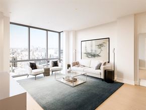 Chicago apartment for rent - the living room of an apartment with a white couch and chairs
