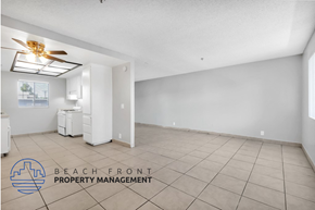 Santa Ana apartment for rent - A spacious room with a ceiling fan and tiled floor.