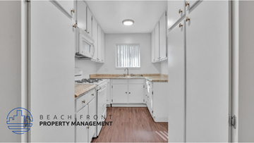 El Monte apartment for rent - a white kitchen with white cabinets and a window