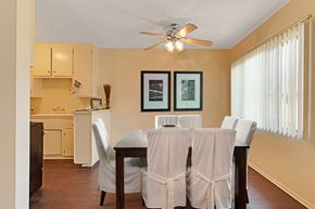 Sherman Oaks apartment for rent - A dining room with a table set for two.