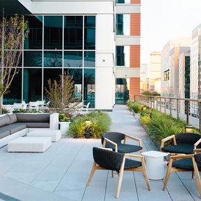 Boston apartment for rent - a terrace with chairs and couches and tables outside of a building