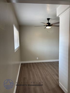 Anaheim apartment for rent - A room with a ceiling fan and wooden flooring.
