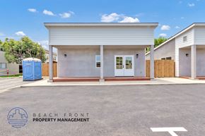 Costa Mesa apartment for rent - A building with the words Beach Front Property Management on the ground.
