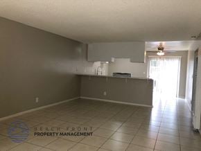 Costa Mesa apartment for rent - A spacious room with a kitchenette and a window.