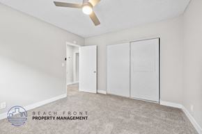 Anaheim apartment for rent - A room with a carpeted floor and a ceiling fan.