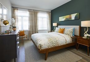 North Bergen apartment for rent - a bedroom with a bed and a desk and two windows