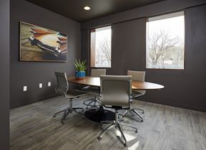North Bergen apartment for rent - a conference room with a table and chairs and a painting on the wall
