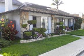 Huntington Beach apartment for rent - a house with a lawn and a sidewalk in front of it