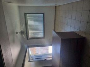 Huntington Beach apartment for rent - a bathroom with a window and a ceiling fan