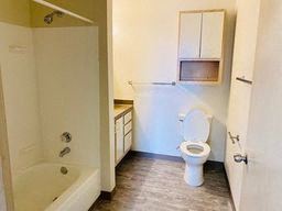 Everett apartment for rent - a bathroom with a toilet and a tub and a sink