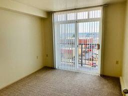 Everett apartment for rent - an empty living room with a sliding glass door