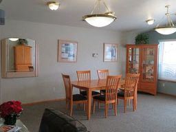 Marysville apartment for rent - a dining room with a wooden table and chairs