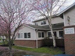 Marysville apartment for rent - a large white house with a sign in front of it