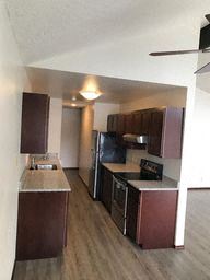 Everett apartment for rent - an empty kitchen with a stove and a refrigerator