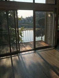 Everett apartment for rent - a living room with glass doors and a view of a lake