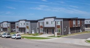 Brandon townhouse for rent - a row of town houses with cars parked in front