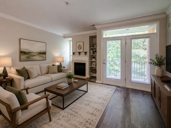 Cherry Hill apartment for rent - A living room with a white couch, a coffee table, and a painting on the wall.