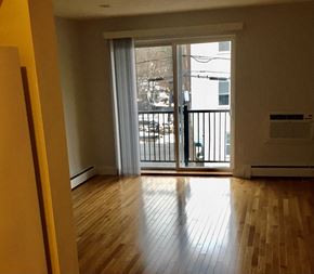 Quincy apartment for rent - Living Room with Hardwood Floors and Slider Doors