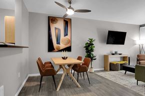 Eugene apartment for rent - A modern dining room with a wooden table and chairs.