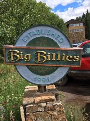 Telluride apartment for rent - a sign that reads big bites in front of a parking lot