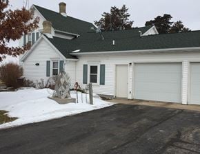 Middleton apartment for rent - a white house with a driveway and a garage door