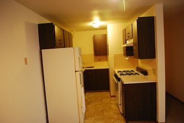 Sun Prairie apartment for rent - a kitchen with a refrigerator and a stove and