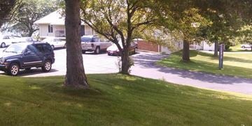 Mount Horeb apartment for rent - a car parked in a parking lot next to trees