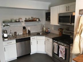 Philadelphia apartment for rent - a kitchen with stainless steel appliances and white cabinets