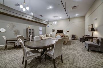 Erie apartment for rent - a large living room with a table and chairs