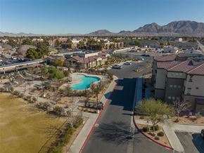 Las Vegas apartment for rent - an aerial view of a neighborhood with a swimming pool and buildings
