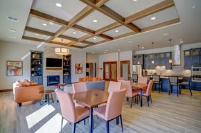 Middleton apartment for rent - a large dining room with tables and chairs and a kitchen