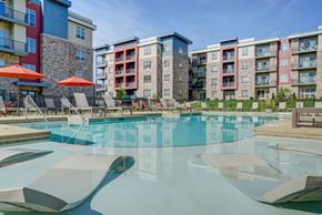 Middleton apartment for rent - a swimming pool with an apartment building in the background