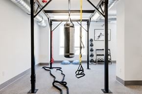 Glendale apartment for rent - A gym with a punching bag, a rope and a bench.